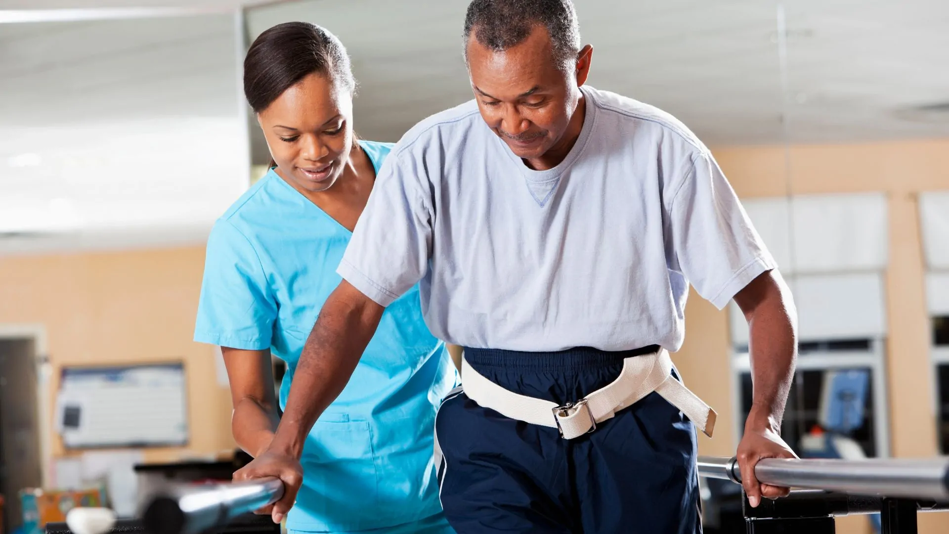 Physiotherapist supporting a patient during movement rehabilitation